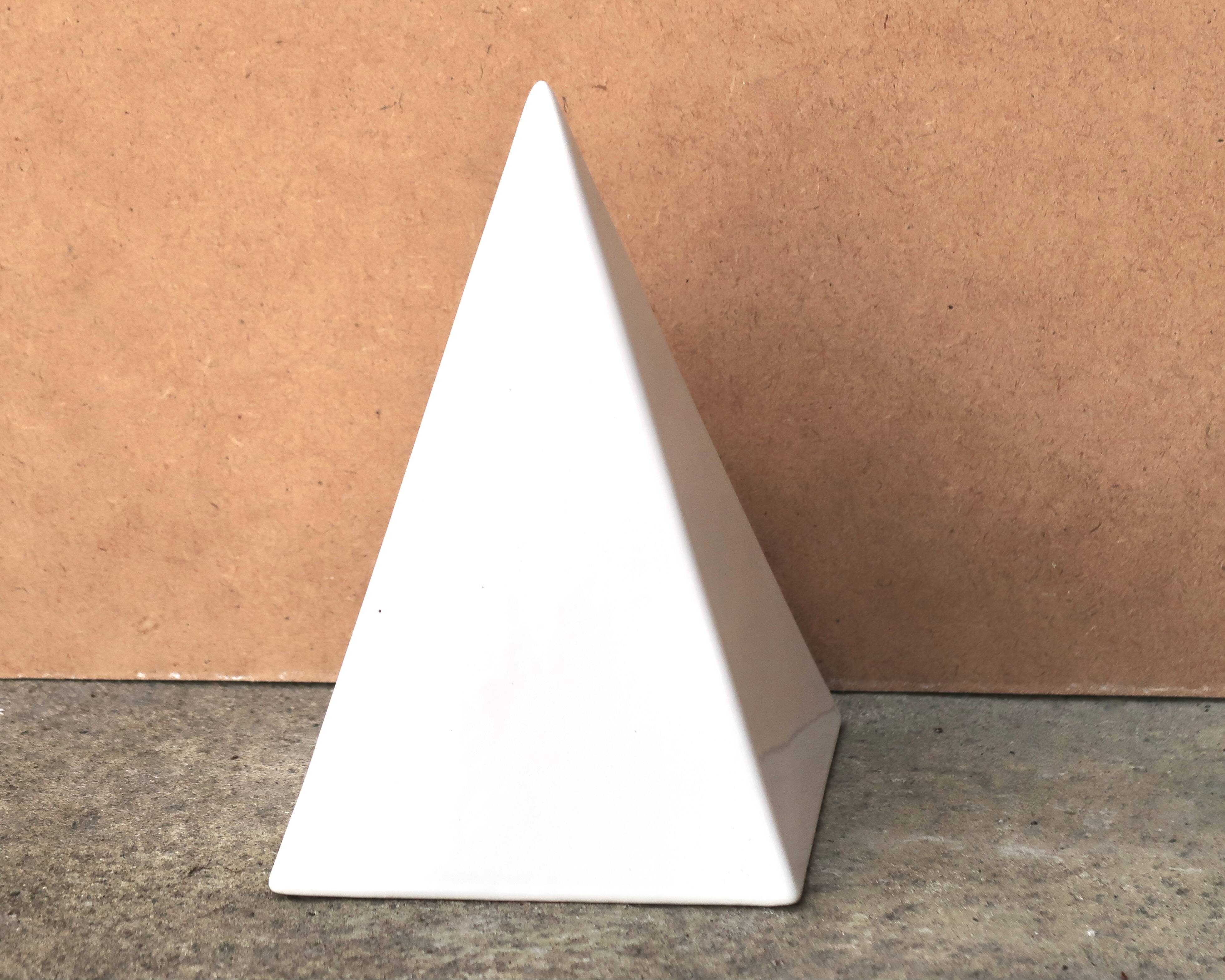 Minimalist white ceramic pyramid sculpture, 1970s.