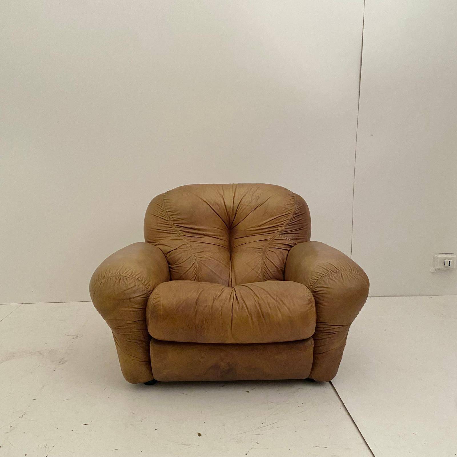Pair of brown leather armchairs