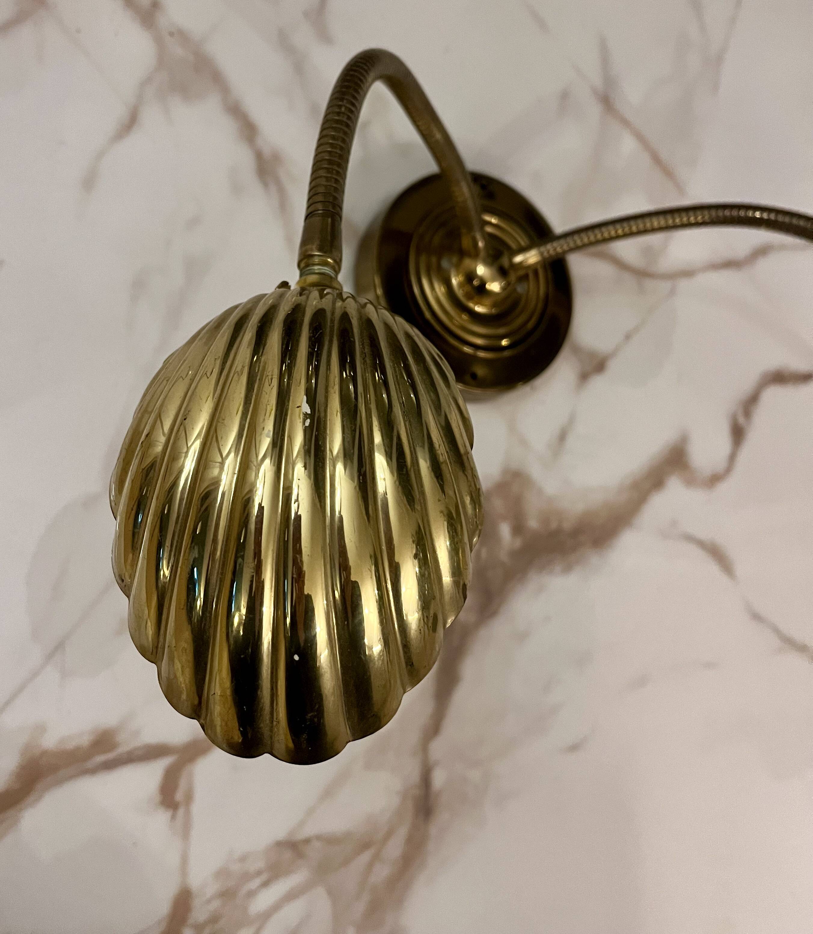 Articulated shell wall light