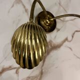 Articulated shell wall light
