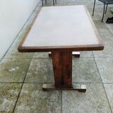 Old bistro table in wood and brass.