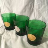 3 green glasses with silver gold shields