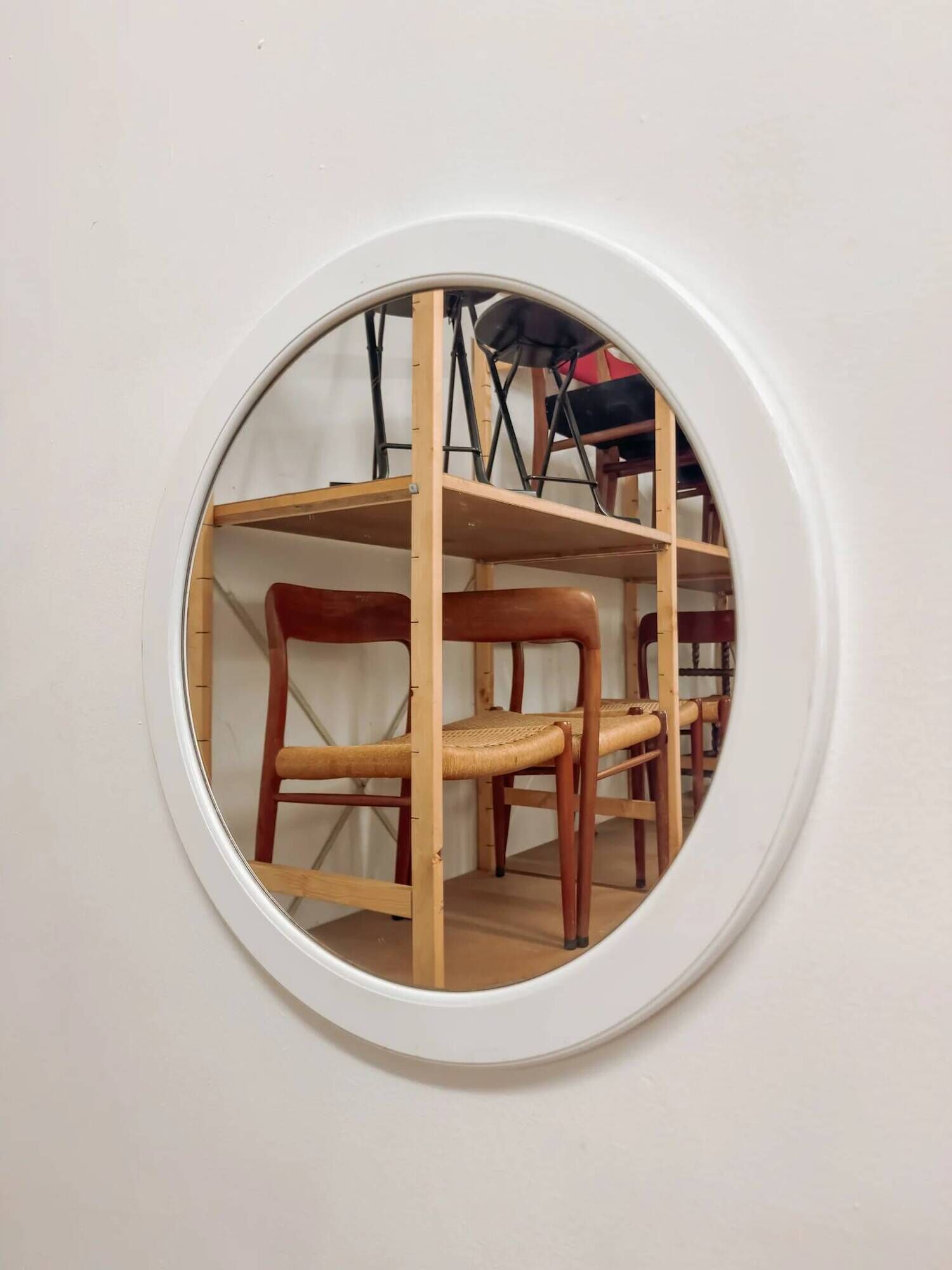 Large vintage round mirror with a white border.