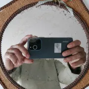 Vintage mirror in handwoven raffia Art Monique 1970s
