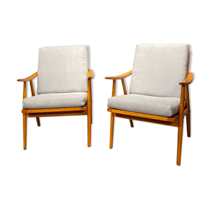 Une paire de fauteuils club ton vintage années 1960