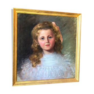 Huile sur toile du XIXe siècle représentant un portrait de petite fille avec son cadre en bois doré