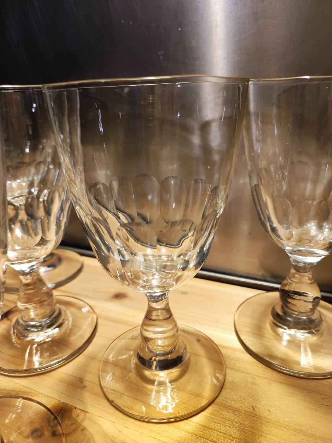 5 antique wine glasses with cut sides