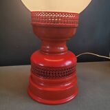 Vintage globe lamp with a metal base, perforated and lacquered in red.