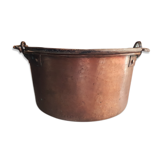 Ancient copper cauldron and wrought iron handle