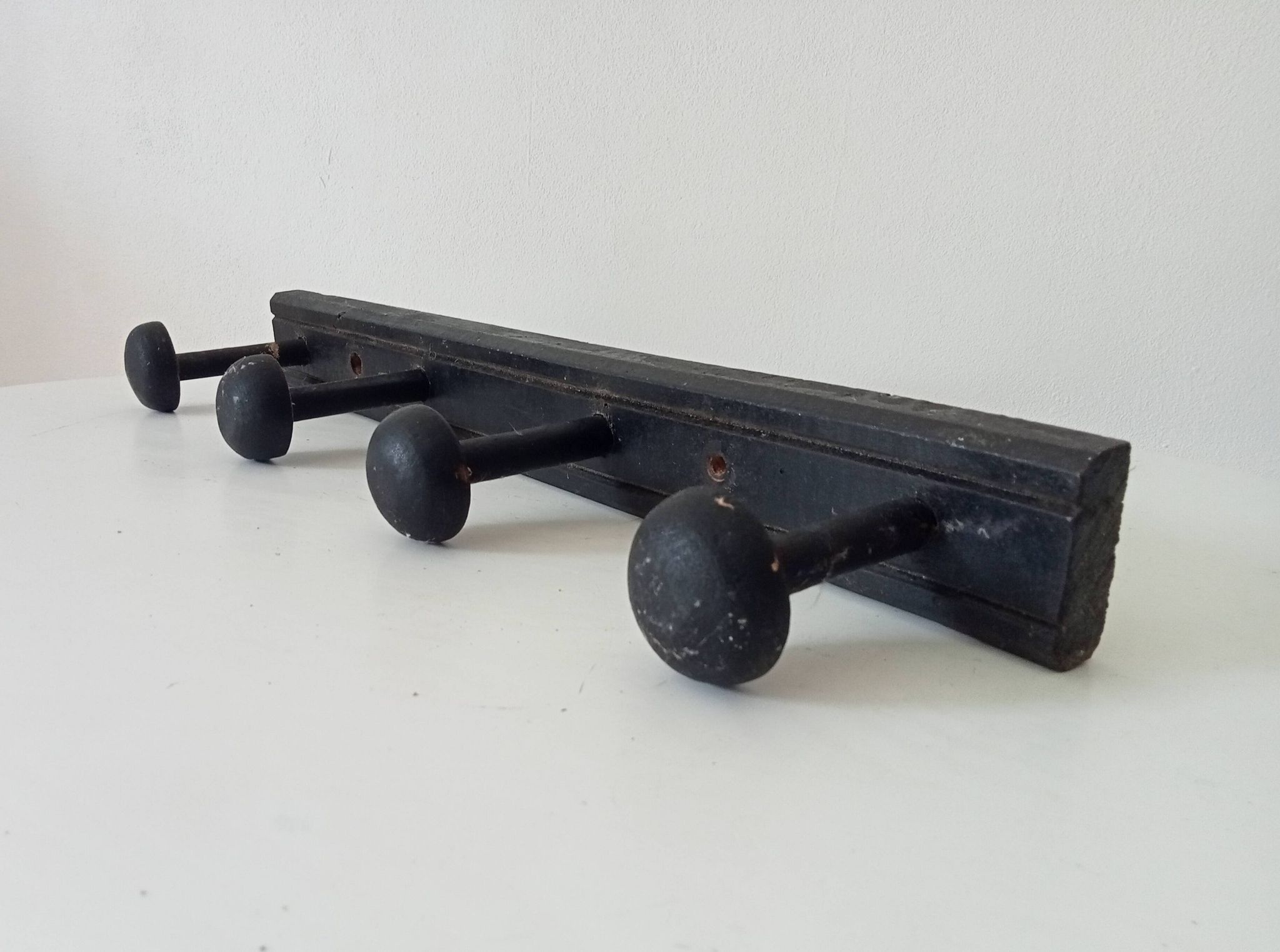 Old wooden wall coat rack