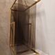 Brass shelf, smoked glass