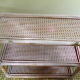 Pink rattan and cane shelf