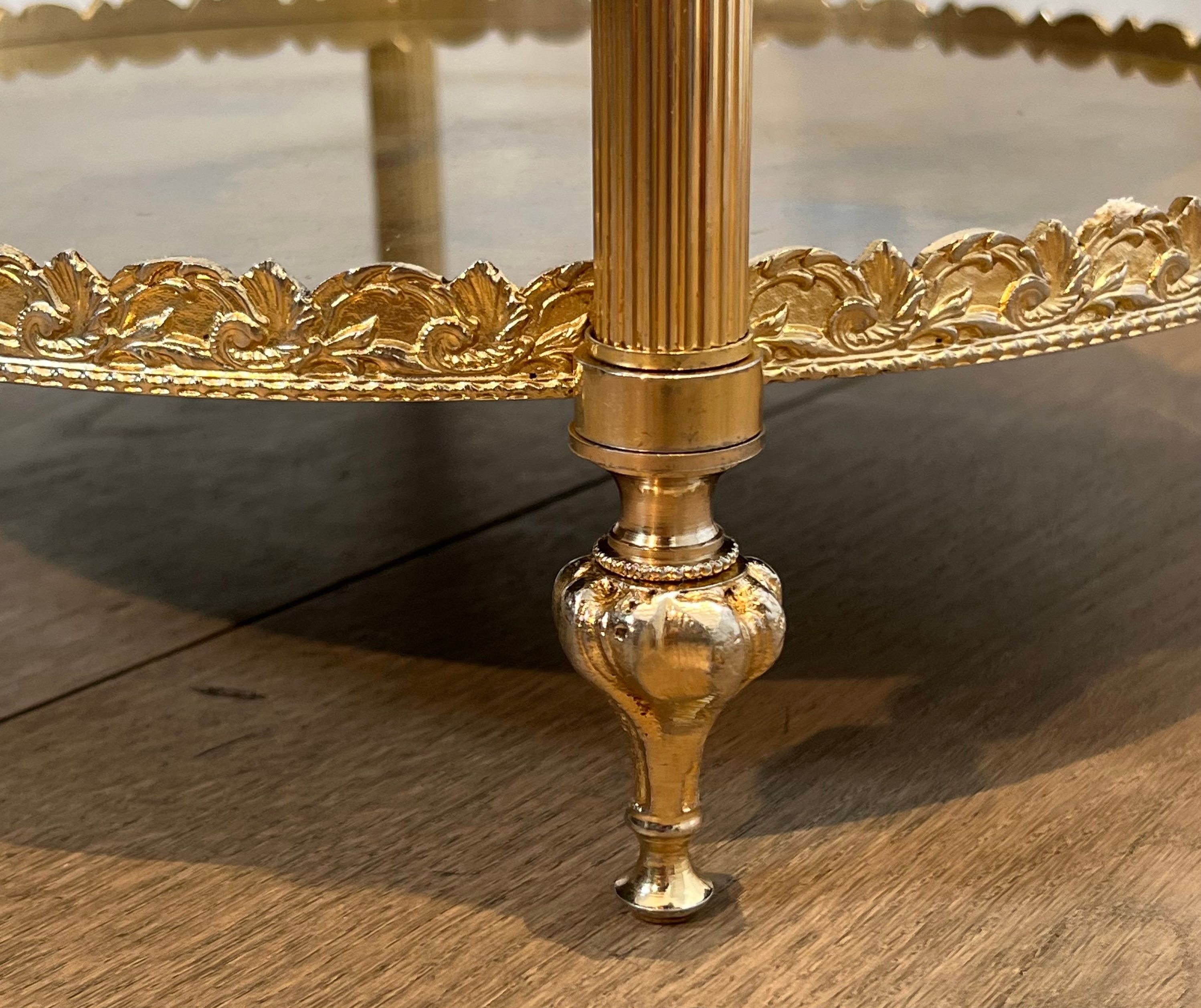 Round silver-plated brass table with triple eglomisé mirror tops from Maison Jansen.