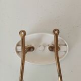 Vintage wall coat hook in brass and Bakelite.