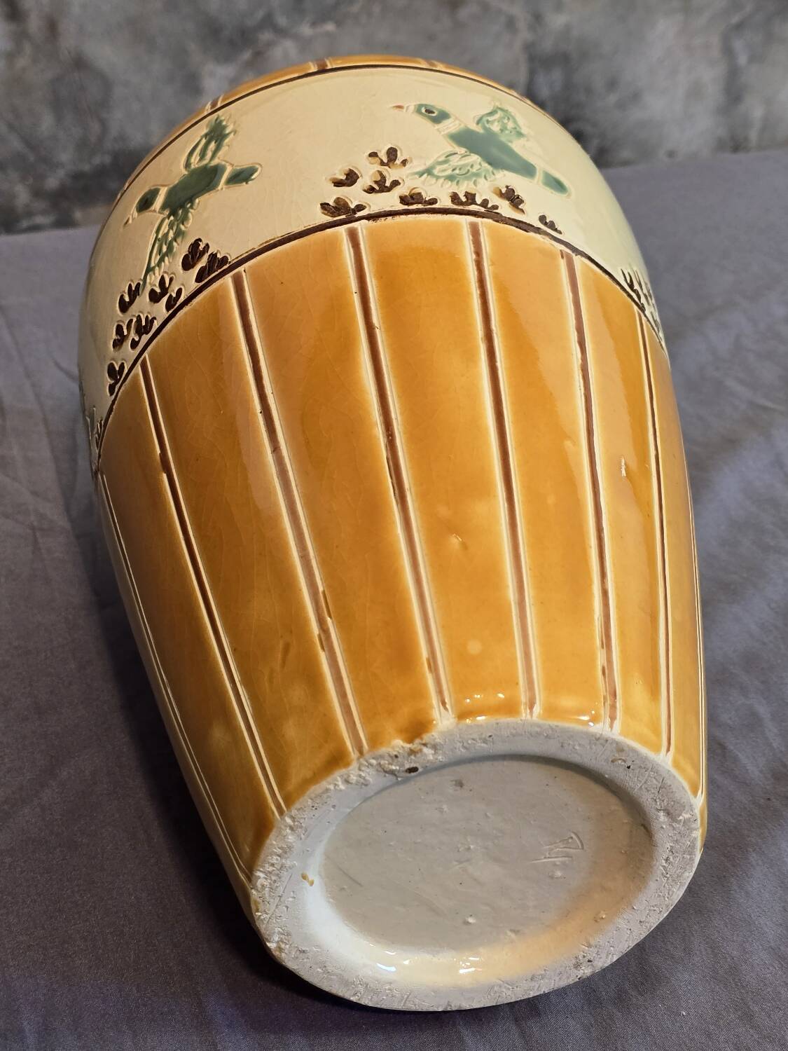 Orange and green ceramic vase with duck motif