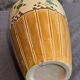 Orange and green ceramic vase with duck motif