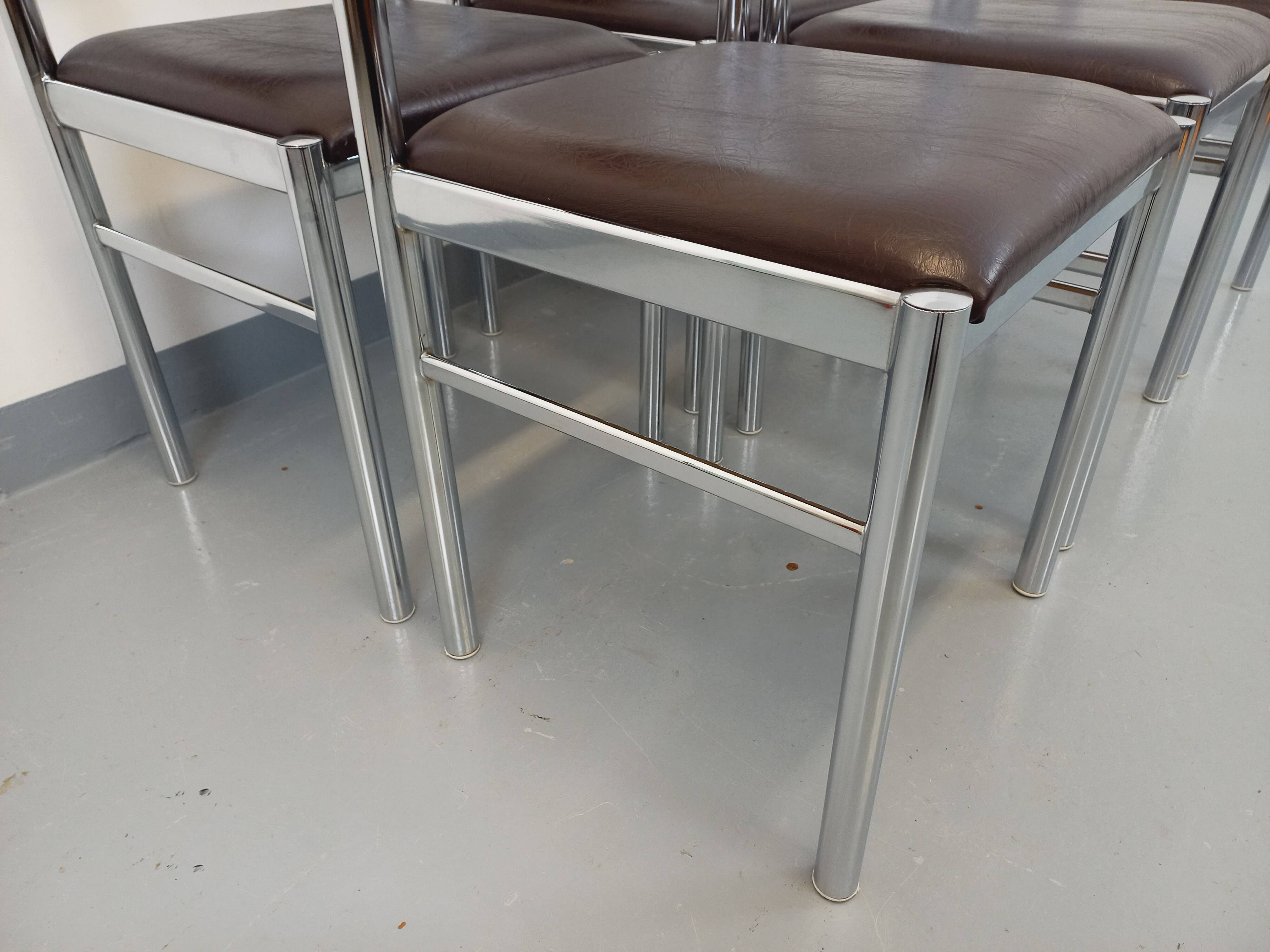 Set of 6 vintage chairs from the 70s in chrome metal and brown faux leather.