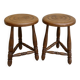 Pair of solid wood tripod stools, carved.