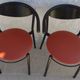 4 Gondola-style chairs with a sturdy metal frame and faux leather for