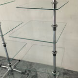 A pair of vintage side tables in glass and chrome metal.