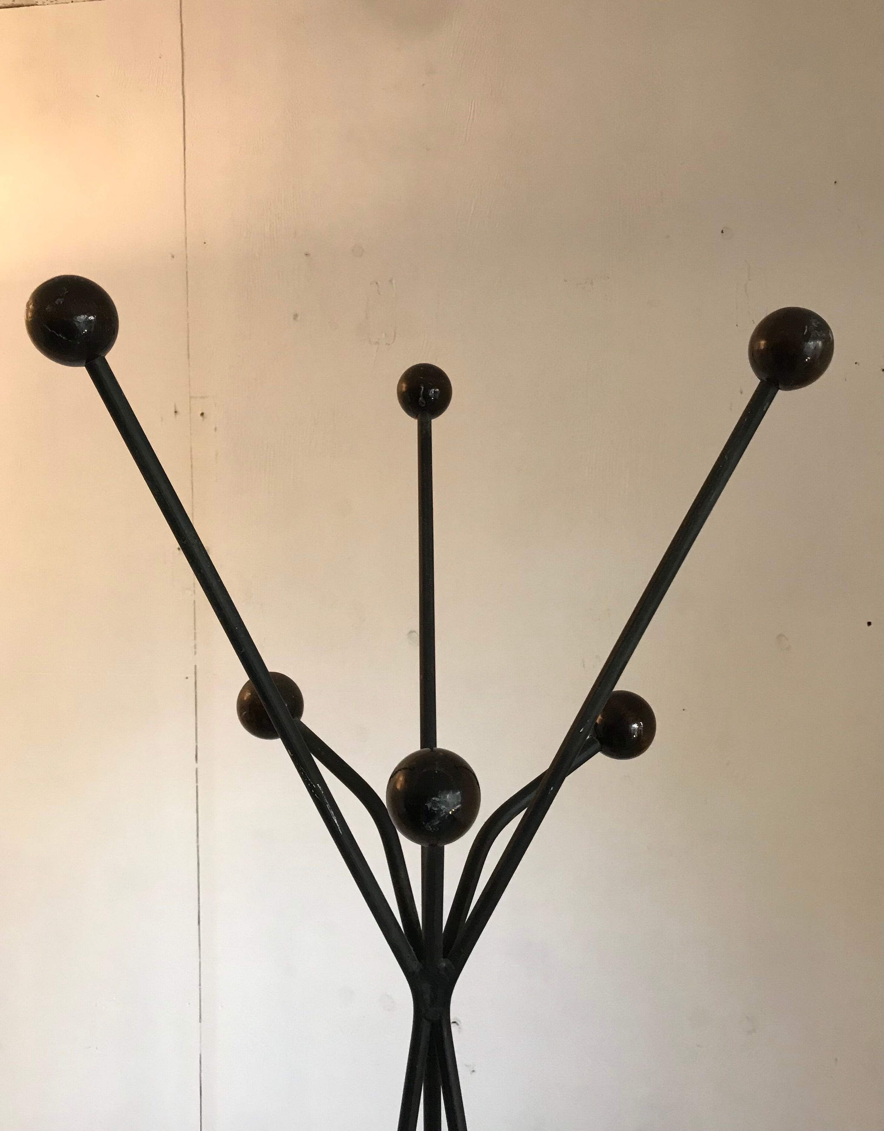 Black steel tripod coat holder