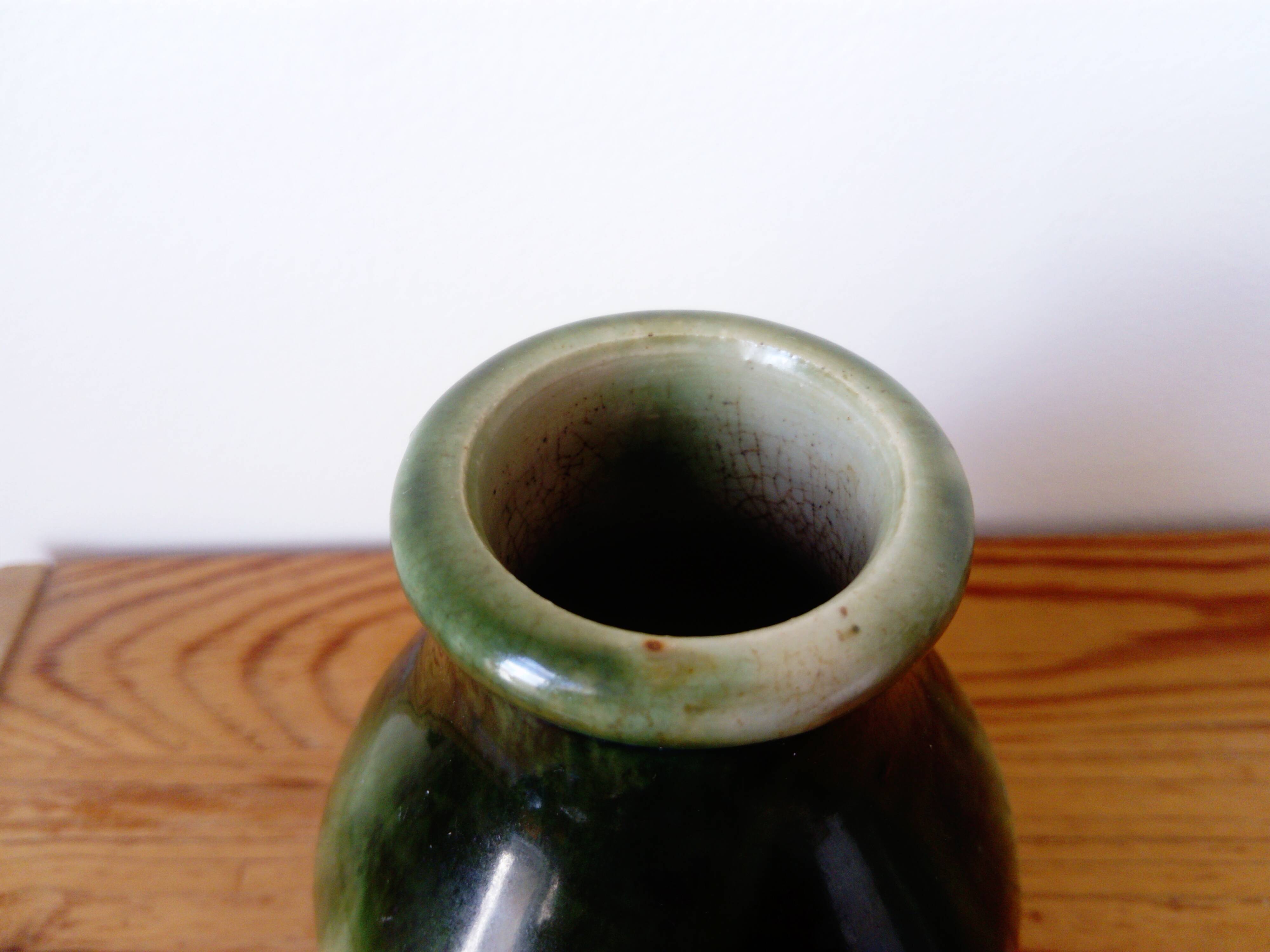 small green and cream glazed ceramic vase