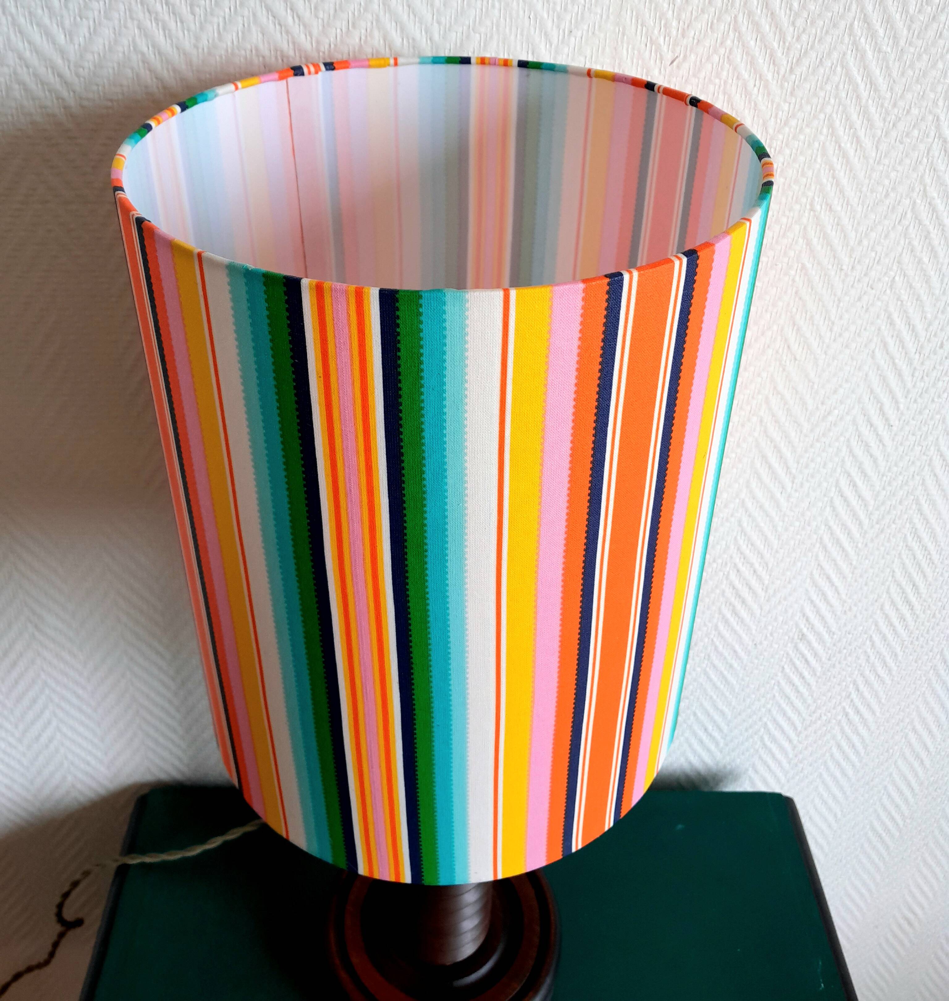 Wooden lamp with striped lampshade