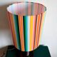 Wooden lamp with striped lampshade
