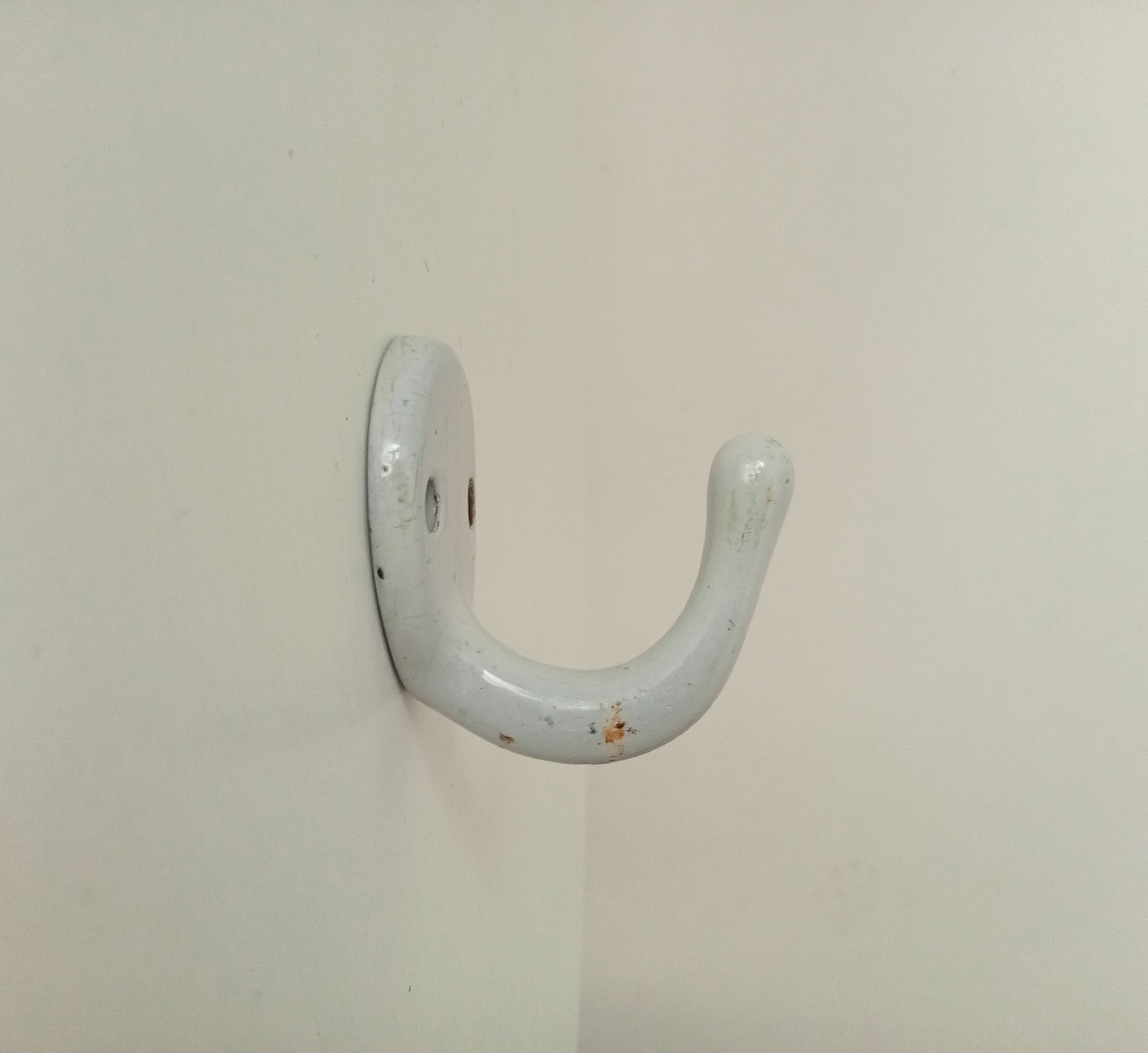 Antique enamelled cast iron wall hook from the 30s/40s