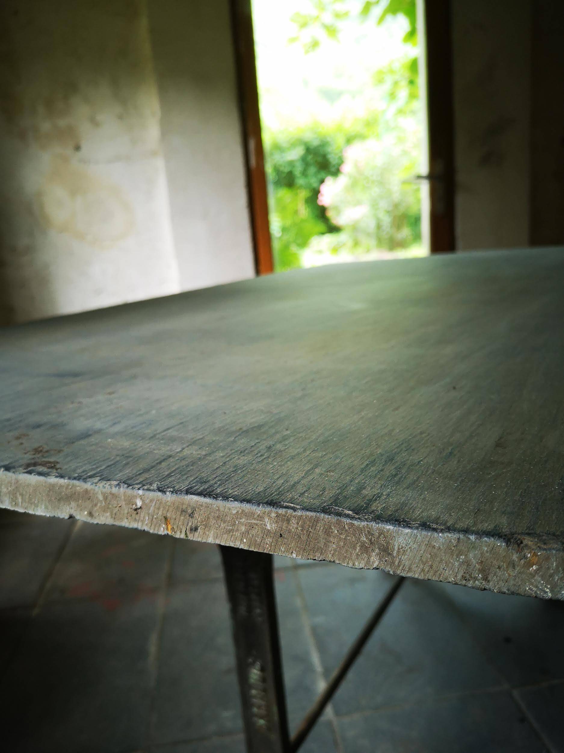 Old bistro table – cast iron legs and natural slate top