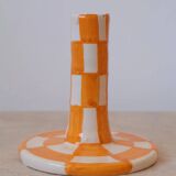 Pair of yellow and white checkered ceramic candlesticks