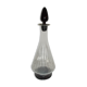 Dark purple glass wine carafe with a stopper.