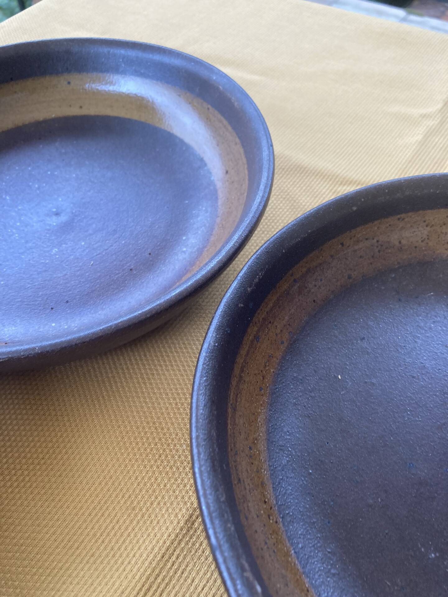 Organic earthenware deep plates from Gré du Marais, France.