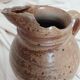 Old farm jug in glazed stoneware