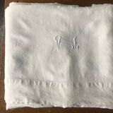 Antique linen sheet with monogram VI