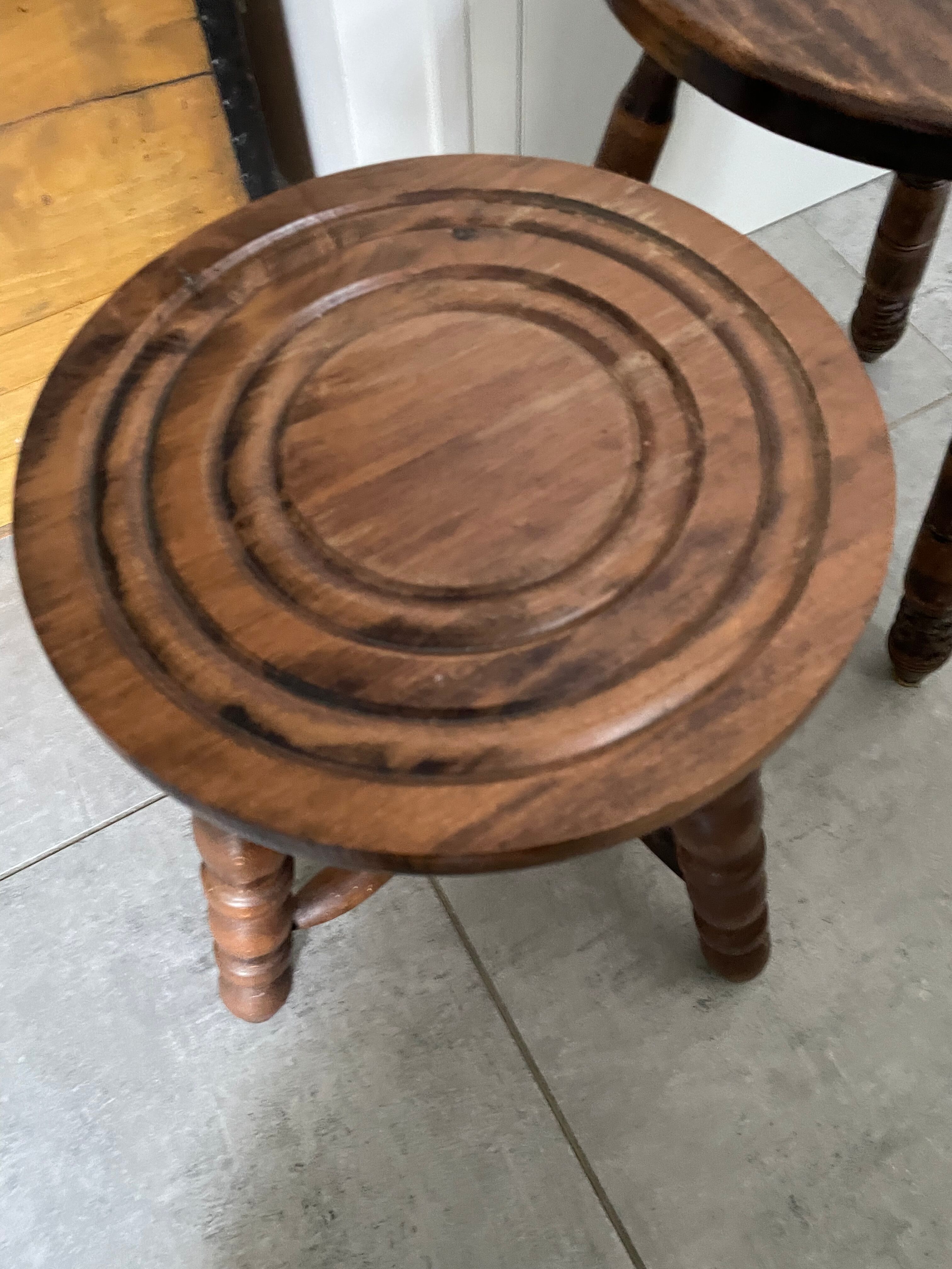 Set of two tripod stools in turned wood