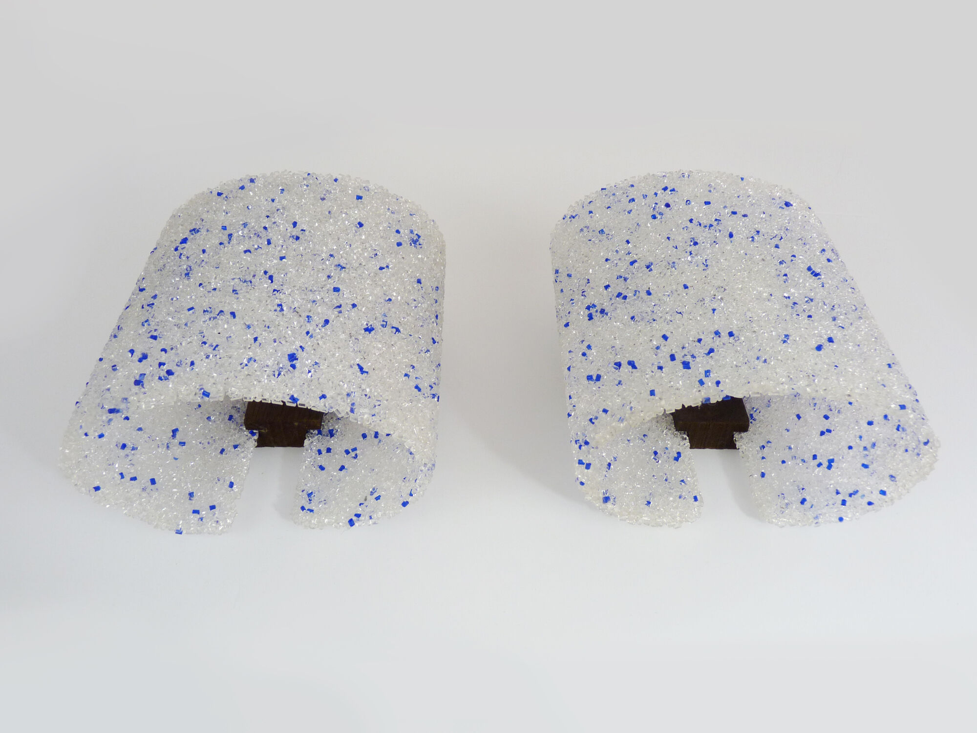 Pair of vintage wall sconces in transparent and wavy blue perspex. Year 60