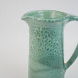 Large green ceramic pitcher with leopard enamel