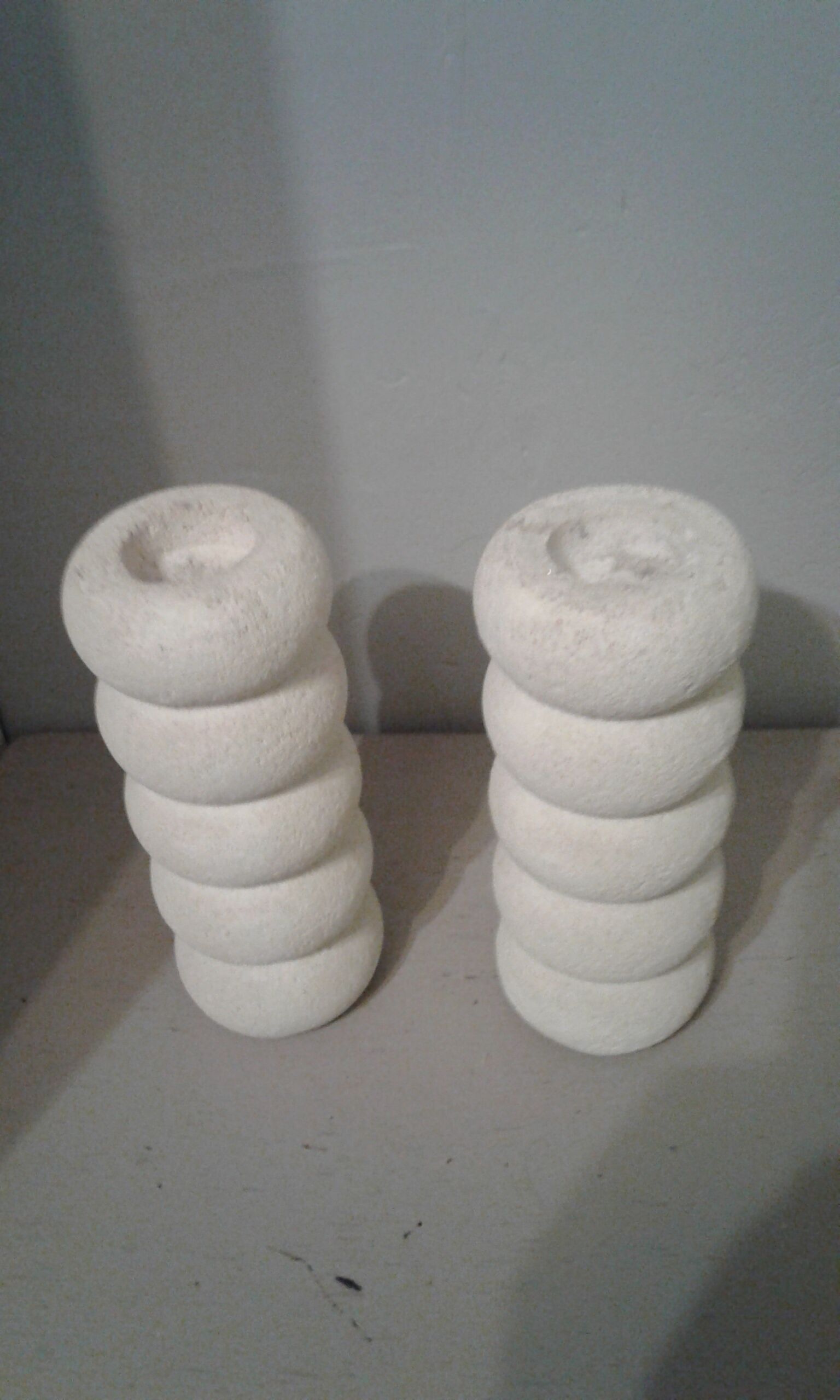 Pair of stone candlesticks