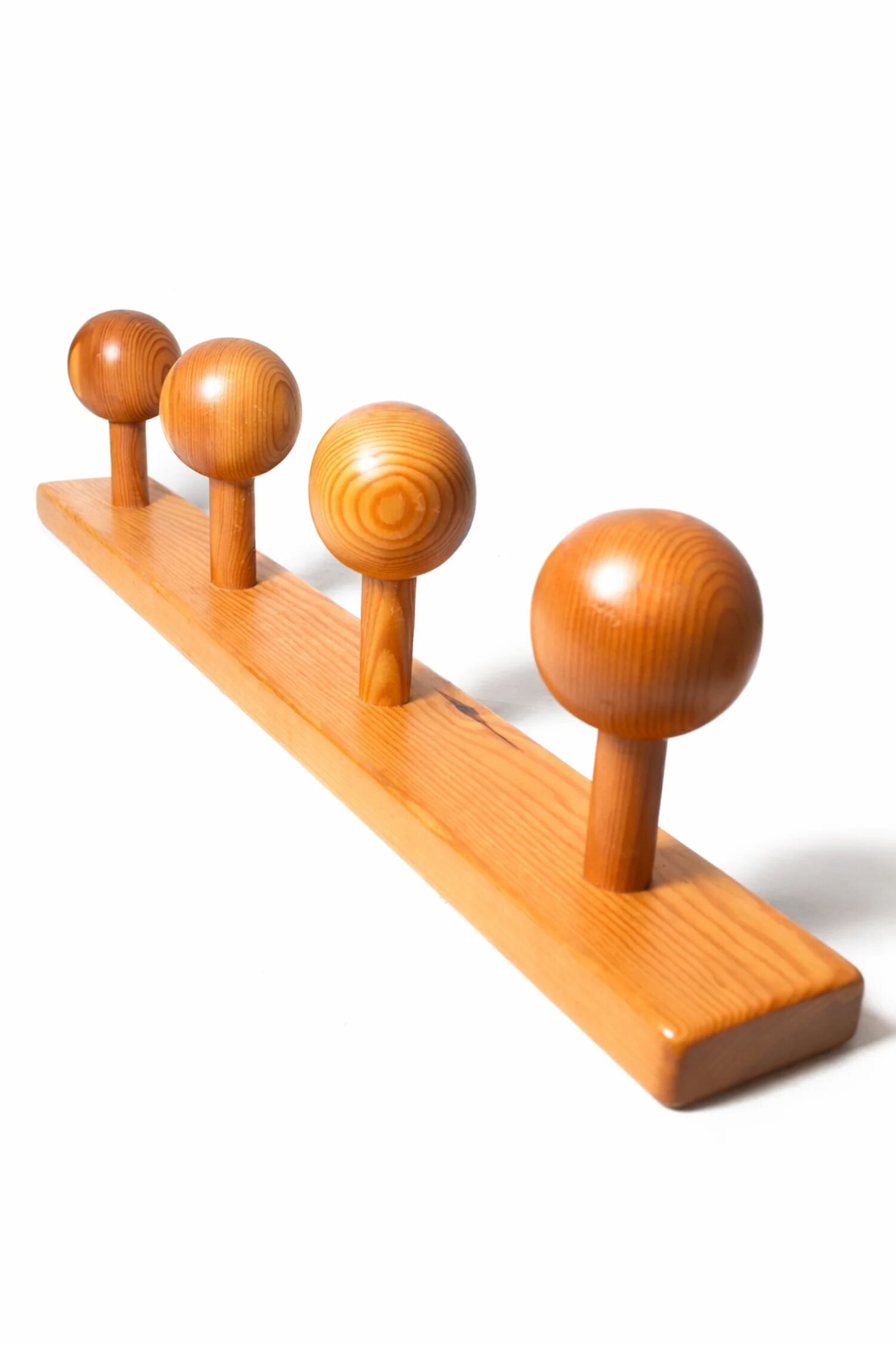 Vintage wall-mounted coat rack in solid pine.