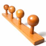 Vintage wall-mounted coat rack in solid pine.