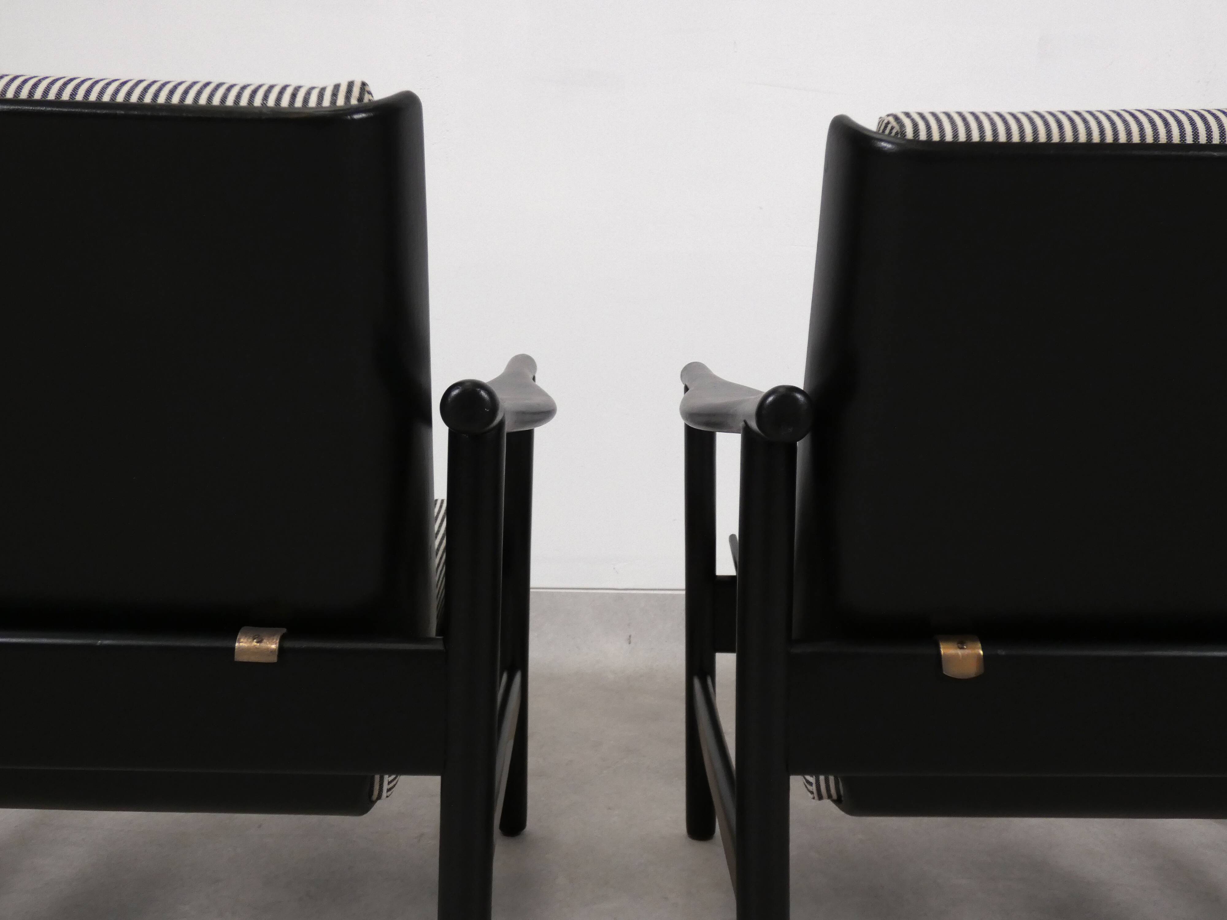 2x wooden Scandinavian arm chairs