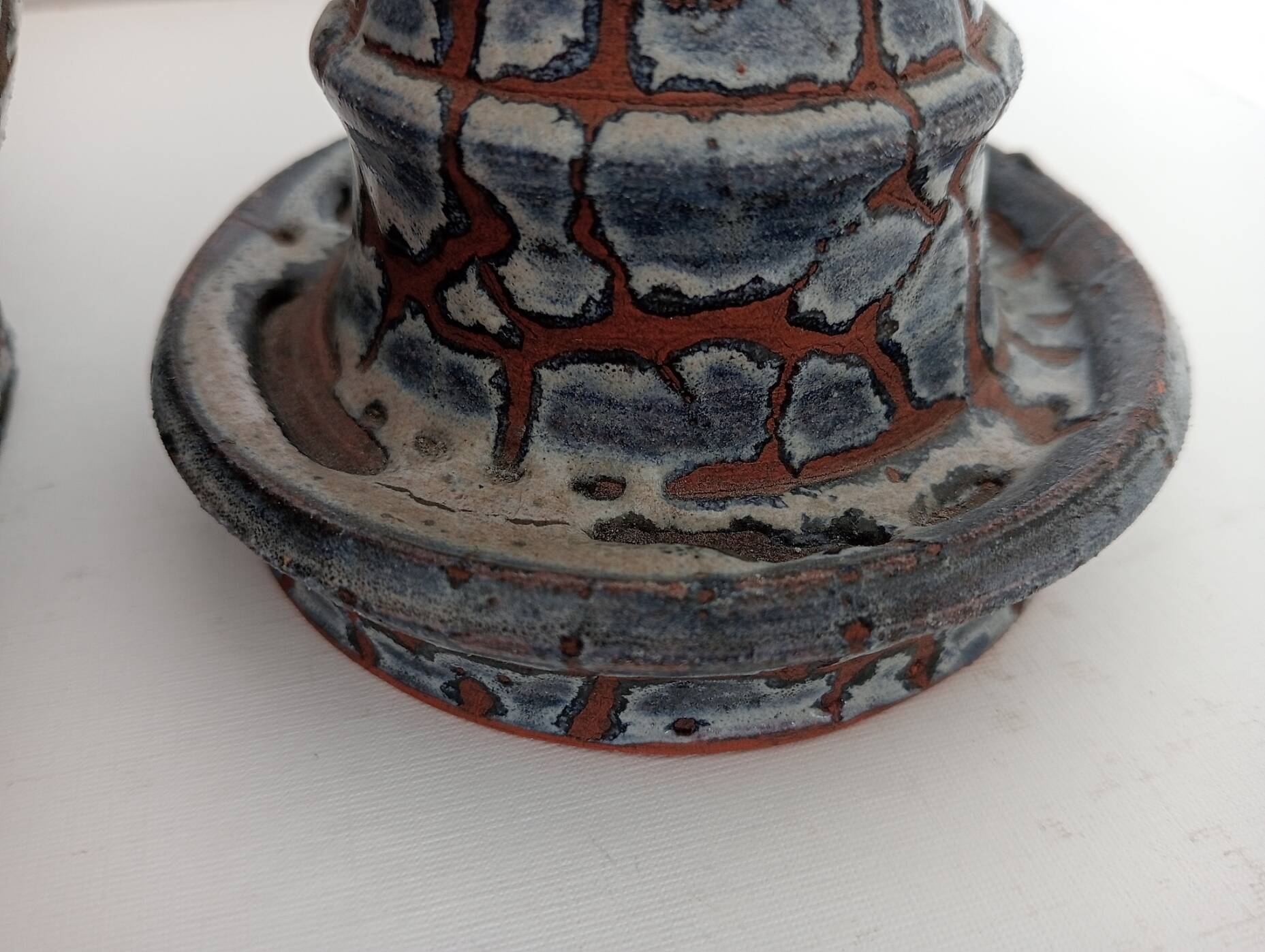 Blue glazed terracotta vase and candle holder