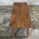 Brown Indonesian teak coffee table, with a border and cylindrical legs H40 L103.