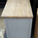 Vintage sideboard painted in gray and raw wood