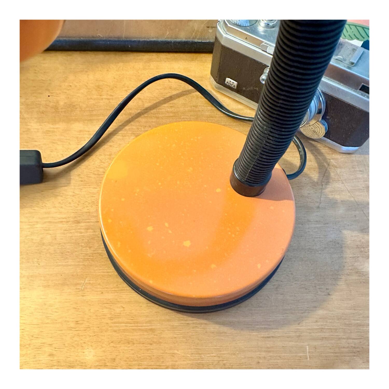 Orange articulated desk lamp