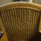 comfortable colonial-style armchair in rattan and mahogany