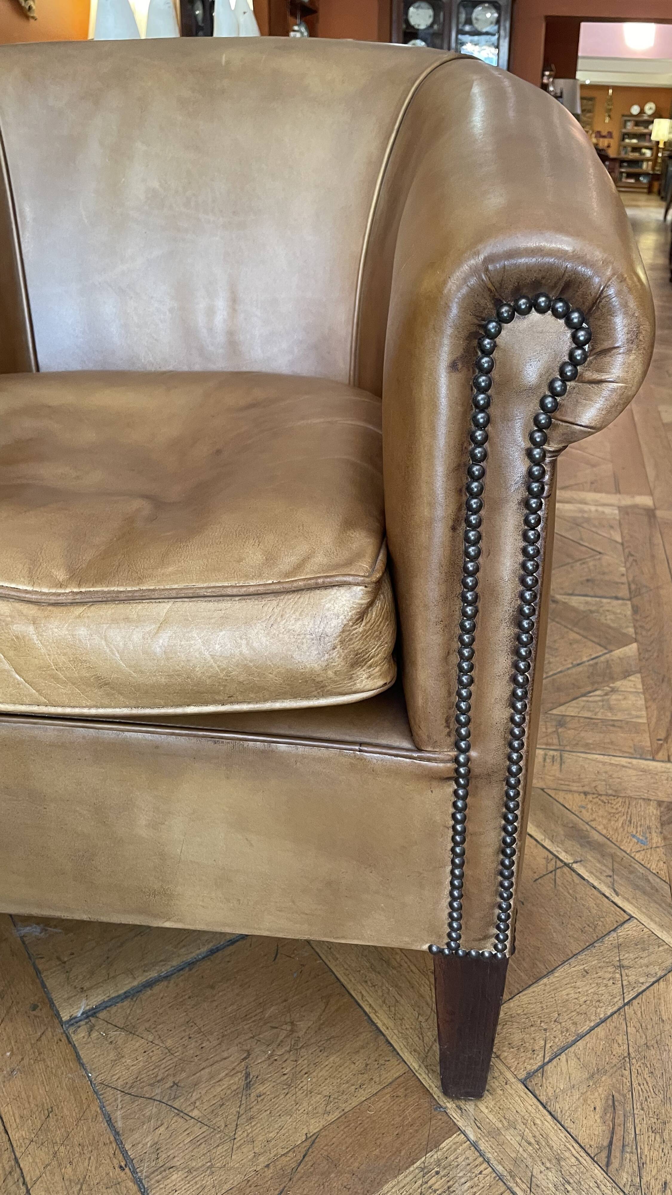 pair of camel leather club armchairs