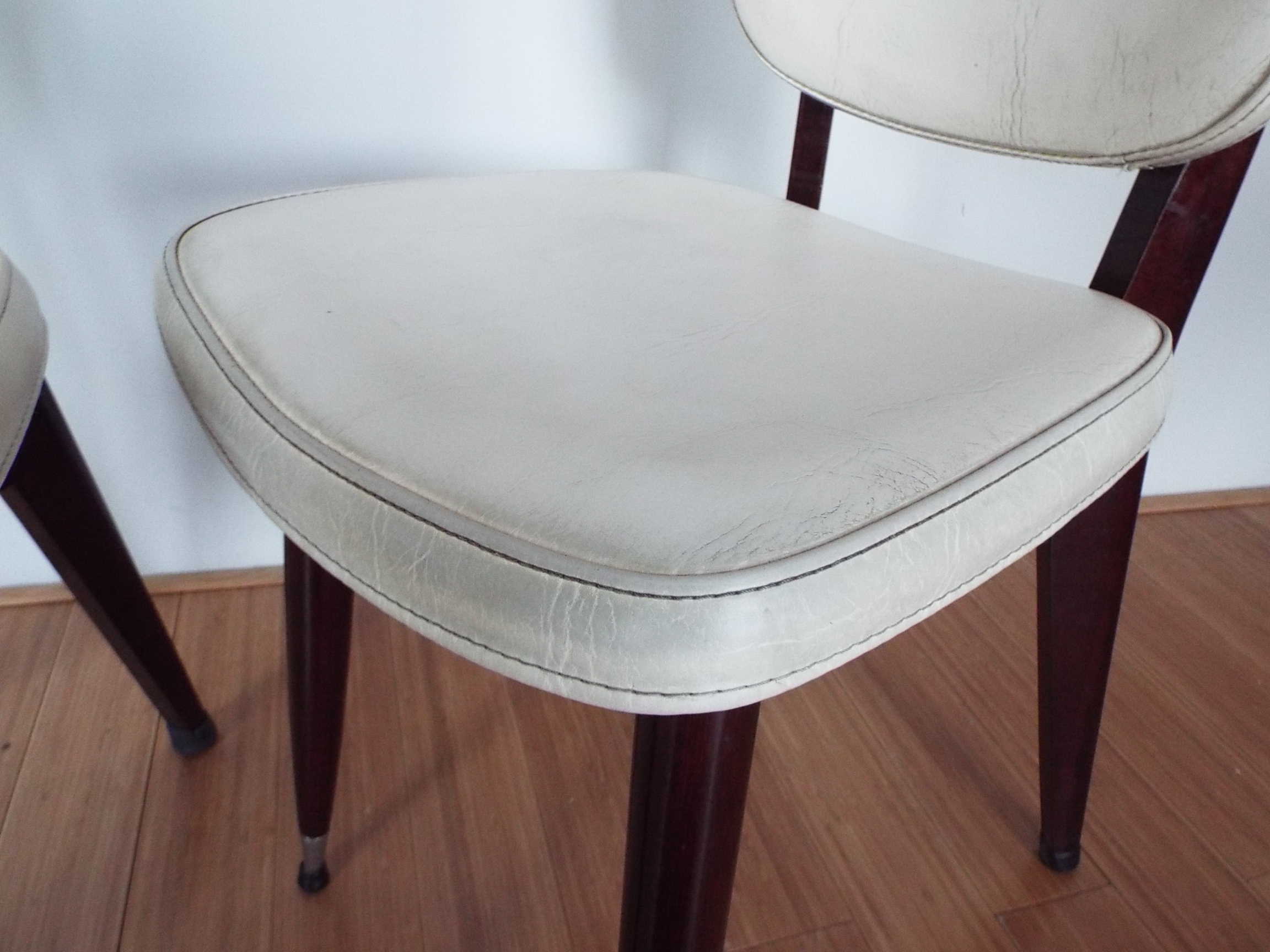 2 skai and wooden chairs