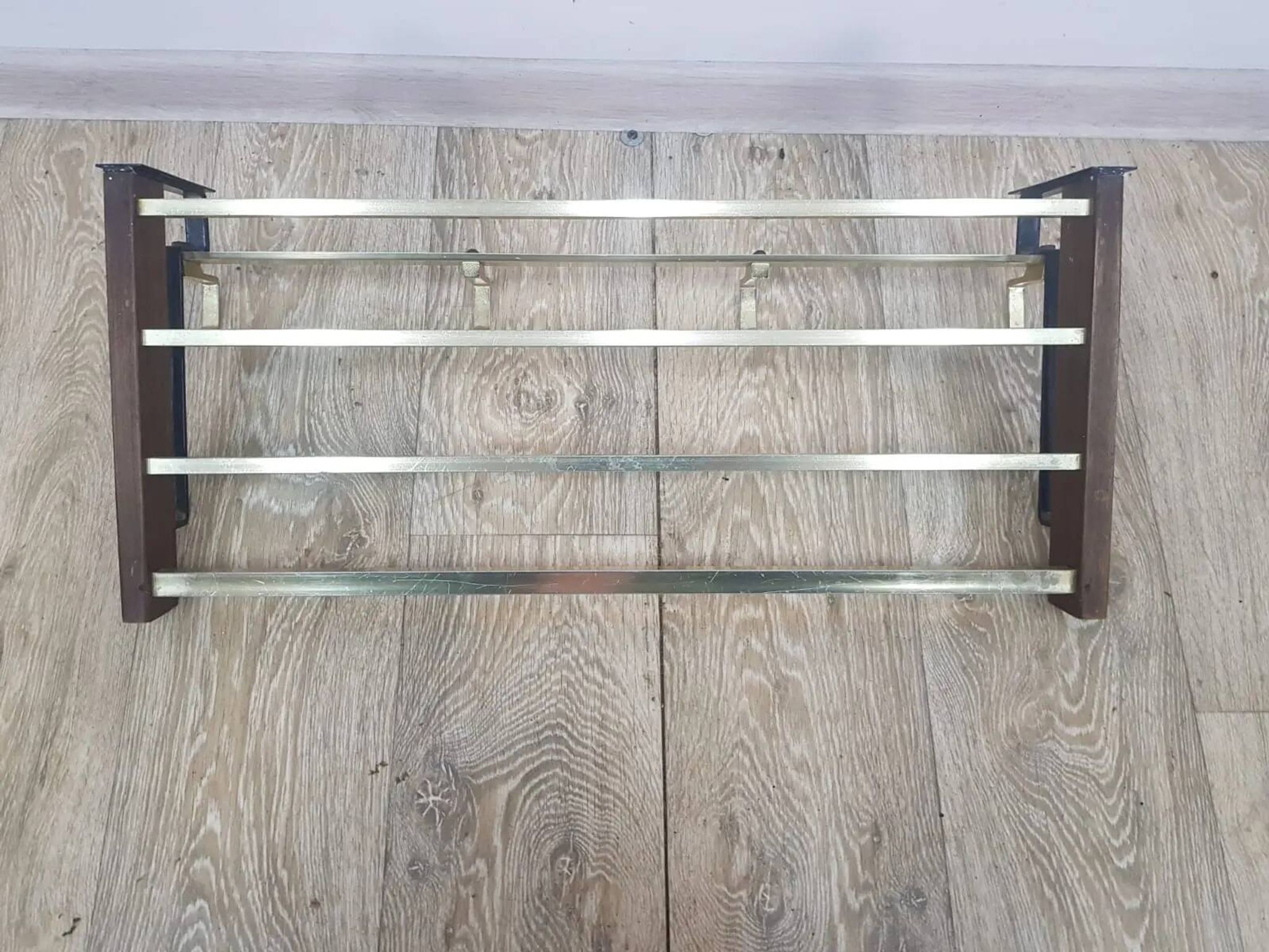 Wall-mounted coat rack, rosewood, gold-tone brass, Austria, 1960s.